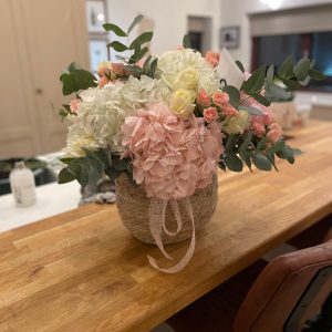 Oasis basket filled with pink and white blooms
